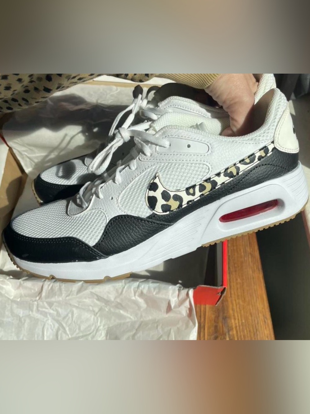 Nike Women’s White and Black Air Max SC with Leopard Swoosh Accent.